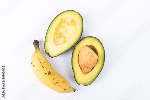 Fresh Avocado with banana on white background. Healthy Fruit Concept.
