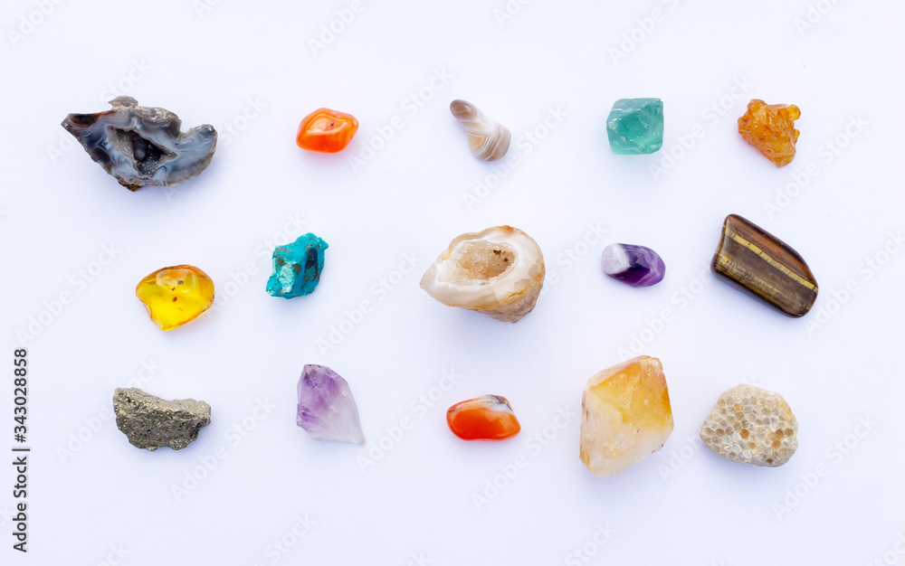 A beautiful collection of mineral stones, gems, crystals, geode on a white background. Stones for stone therapy, lithotherapy, massage with chilled stones. A beautiful collection of mineral stones, gems, crystals, geode on a white background. Stones for stone therapy, lithotherapy, massage with chilled stones.