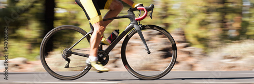 Photography Professional male cyclist in racing outfit during a ride on bike outdoors