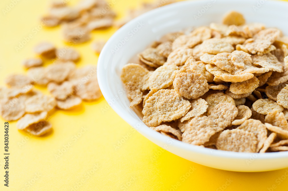 Breakfast ingredients. Cereals with milk. Top view, A bowl of corn flakes and raisins