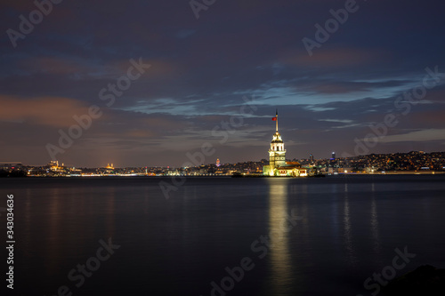 The famous Maiden's Tower or the Leanders Tower (Kiz Kulesi in Turkish) standing in the middle of the Bosphorus, Istanbul, Turkey photo