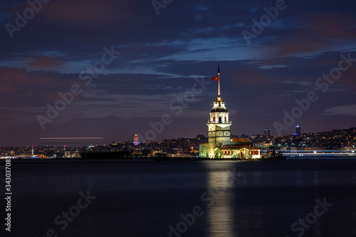 The famous Maiden's Tower or the Leanders Tower (Kiz Kulesi in Turkish) standing in the middle of the Bosphorus, Istanbul, Turkey photo