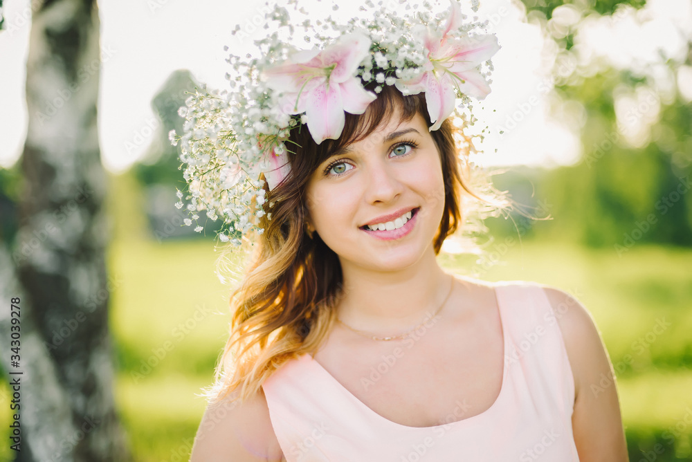 portrait of a young Caucasian girl with a wreath of flowers on her head portrait of a young Caucasian girl with a wreath of flowers on her head