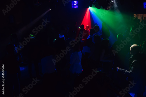 people dancing in a nightclub on the dance floor