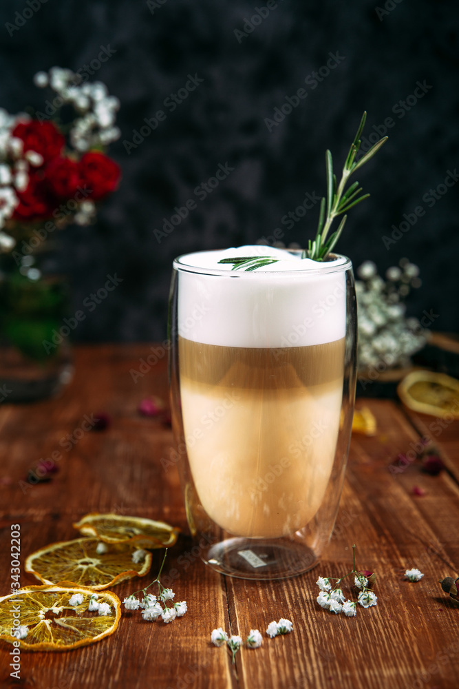 Morning coffee latte with rosemary sprig Morning coffee latte with rosemary sprig