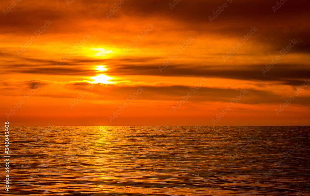 Bright colorful sunset over a calm sea