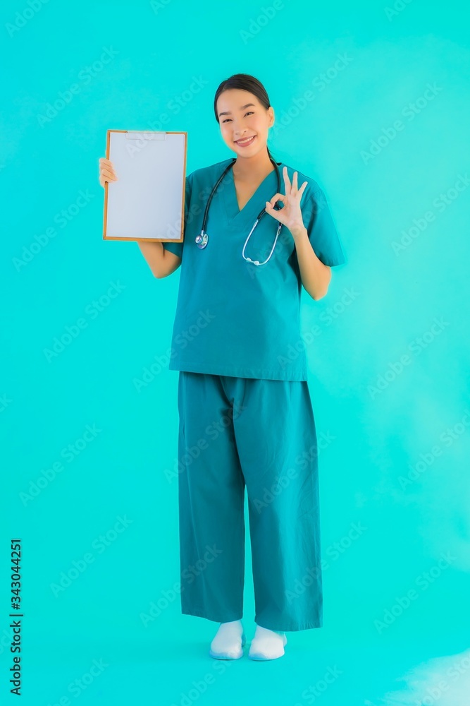 Portrait beautiful young asian doctor woman with empty paper board for copy space Portrait beautiful young asian doctor woman with empty paper board for copy space