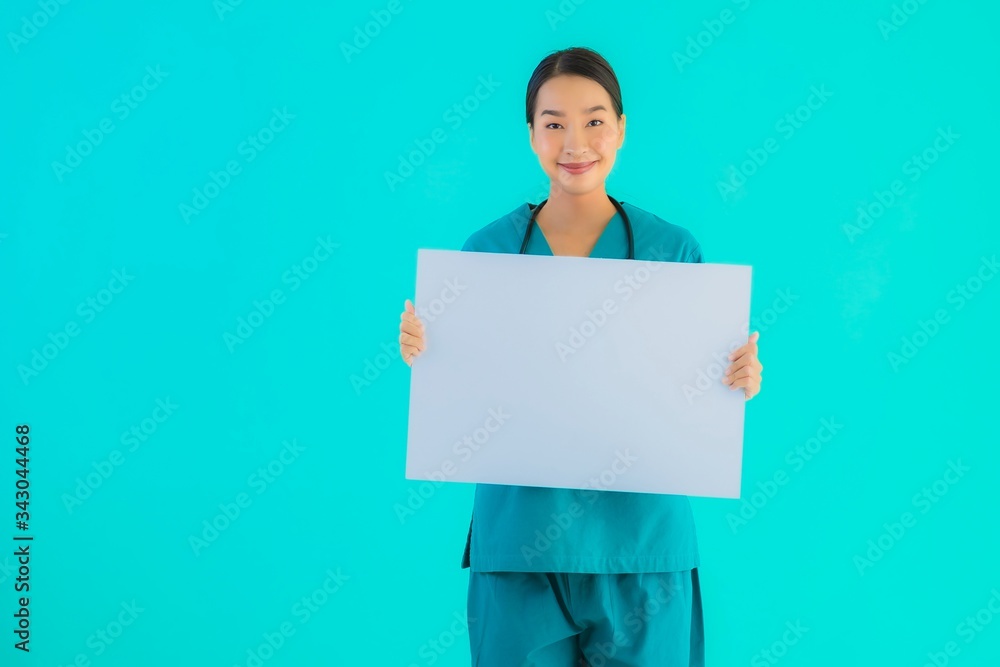 Portrait beautiful young asian doctor woman with empty paper board for copy space Portrait beautiful young asian doctor woman with empty paper board for copy space