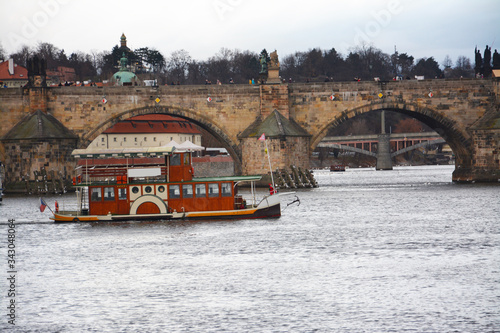 Boating in the Vitava river near the Charles bridge in Prague