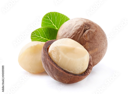 Macadamia nuts with leaves in closeup