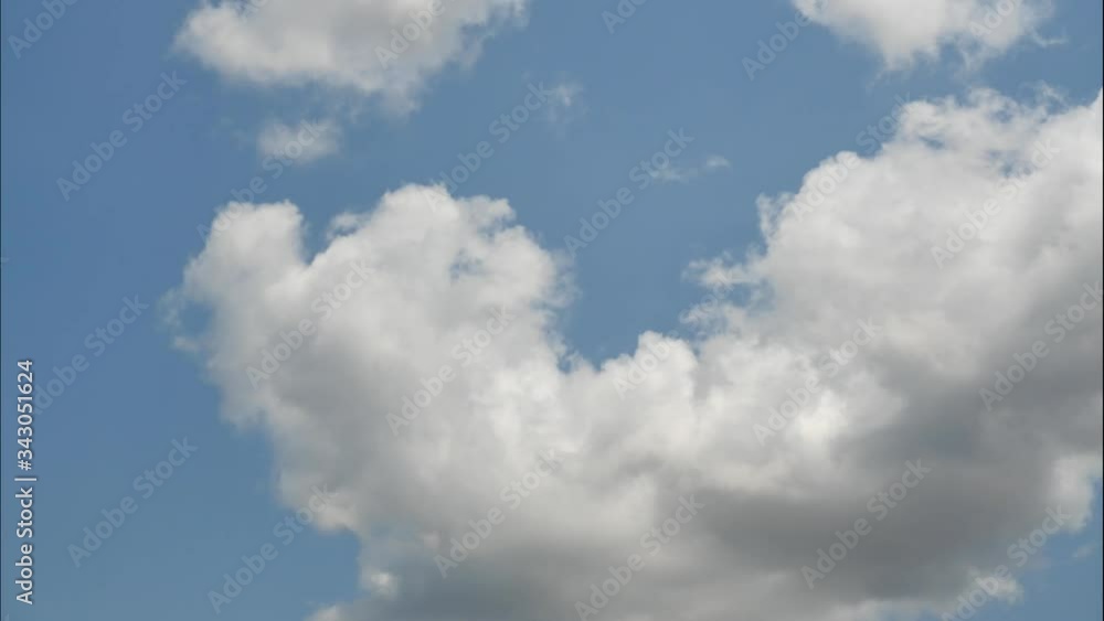 Time lapse clouds are floating from the bottom to the top on sunny blue sky, Cumulus with white fluffy cloud formations at tropical zone , Thailand Time lapse clouds are floating from the bottom to the top on sunny blue sky, Cumulus with white fluffy cloud formations at tropical zone , Thailand