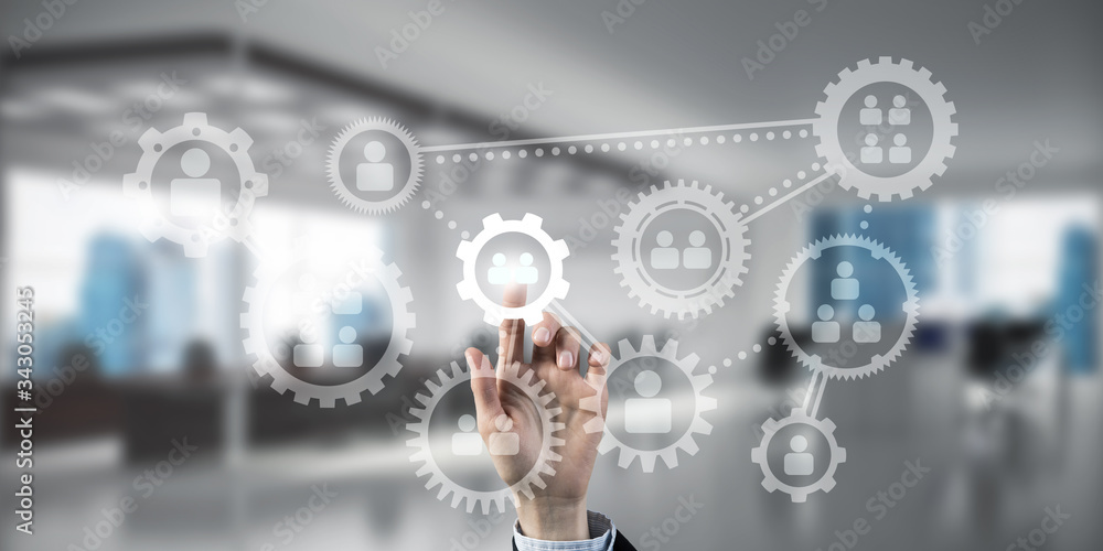 Teamwork concept and choosing gesture of businessperson in elegant modern interior Teamwork concept and choosing gesture of businessperson in elegant modern interior