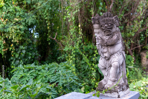 Hindu statue and trees in background