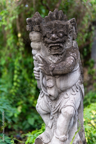 Hindu statue and trees in background