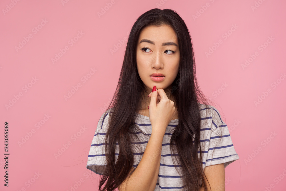 Need to think! Portrait of pensive girl with long hair pondering idea, doubting in choice, reflecting visualizing in mind and making serious decision. indoor studio shot isolated on pink background Need to think! Portrait of pensive girl with long hair pondering idea, doubting in choice, reflecting visualizing in mind and making serious decision. indoor studio shot isolated on pink background
