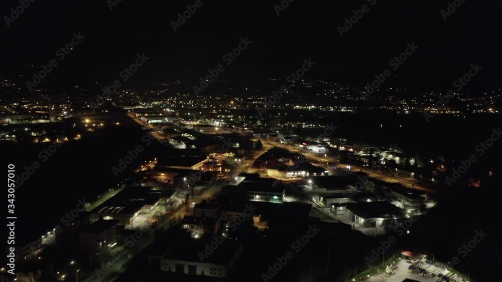 Aerial view of industrial area at night, with view on industry, highway and downtown Aerial view of industrial area at night, with view on industry, highway and downtown