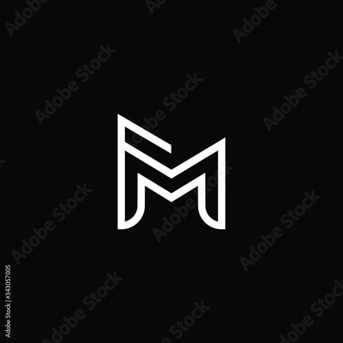 Minimal elegant monogram art logo. Outstanding professional trendy awesome artistic FM MF initial based Alphabet icon logo. Premium Business logo White color on black background
