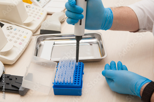 Conducting tests in a medical laboratory.