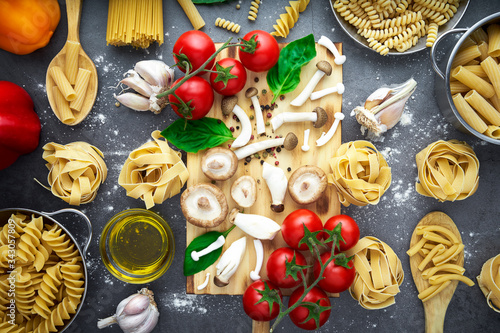 Wallpaper Mural Still life of tortellini, tagliatelle, tortiglioni, fusilloni, casarecce, spaghhetti, macoroni, tomato, mushroom, pepper, olive oil Torontodigital.ca