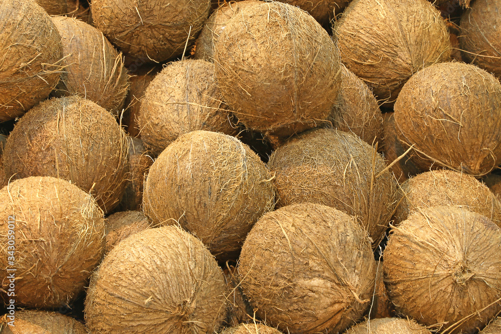Coconuts at a farmers market. Full frame Coconuts at a farmers market. Full frame