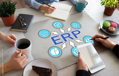 ERP enterprise resource planning business automation technology on office desktop.