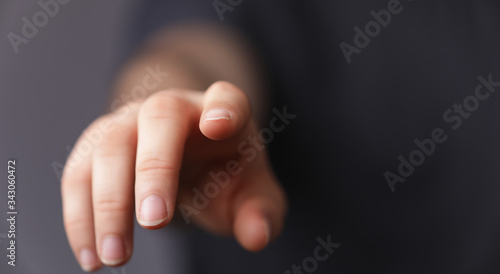 A man hand touching virtual screen, modern background concept , can put your text at the finger, copy space. © vegefox.com