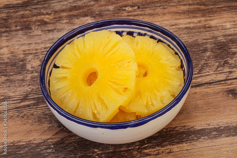 Marinated pineapple rings in the bowl Marinated pineapple rings in the bowl