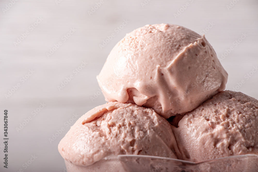 Strawberry ice cream in a flask on a light background Strawberry ice cream in a flask on a light background