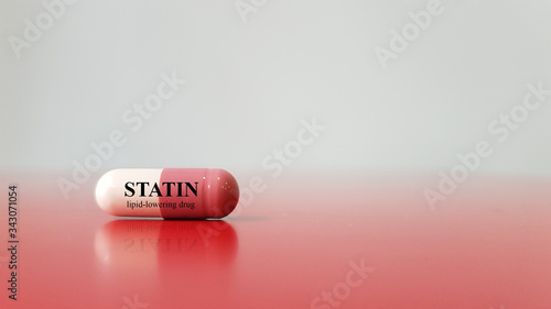 Medication capsule of Statin. Statin is group of antilipidemic drug for treatment dyslipidemia disease or hyperlipidemia(high cholesterol ). Medical treatment technology and side effect concept photo