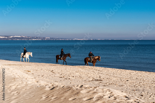 Horse riding on the beach.