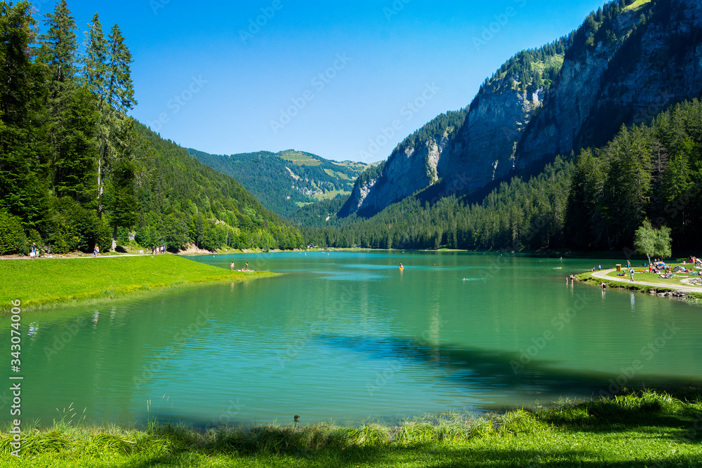 Lake of Montriond, natural lake in Portes du Soleil, Haute -Savoie region, France, an attraction for many tourists, with swimming area, fishing, canoeing.