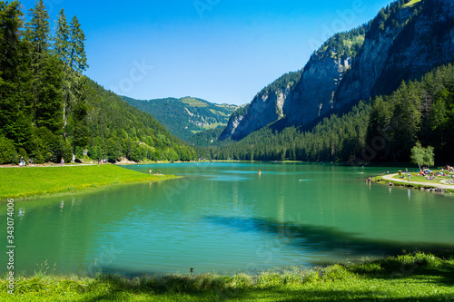 Lake of Montriond, natural lake in Portes du Soleil, Haute -Savoie region, France, an attraction for many tourists, with swimming area, fishing, canoeing.