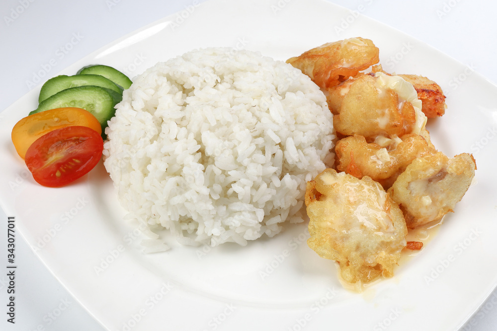 Butter Chicken Rice deep fried boneless chicken cube topped with sweet butter sauce with white rice cucumber and tomato slice Butter Chicken Rice deep fried boneless chicken cube topped with sweet butter sauce with white rice cucumber and tomato slice