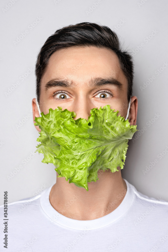 Portrait of man wearing medical creative mask of salad list at white background. Protect your health. Coronavirus concept art
Portrait of man wearing medical creative mask of salad list at white background. Protect your health. Coronavirus concept art
