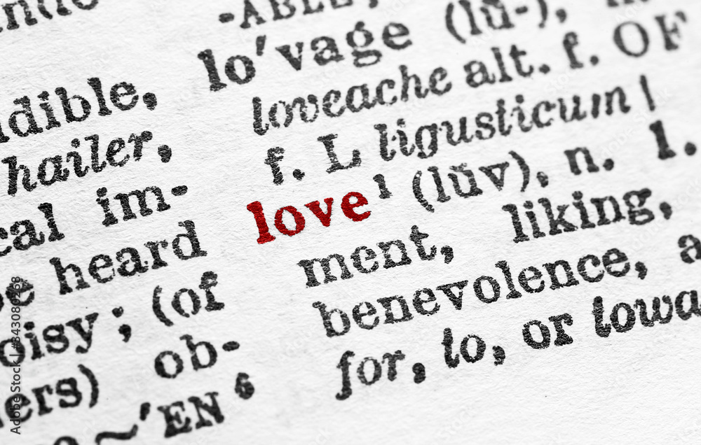 Love - Closeup macro of English dictionary page with word love concept Love - Closeup macro of English dictionary page with word love concept