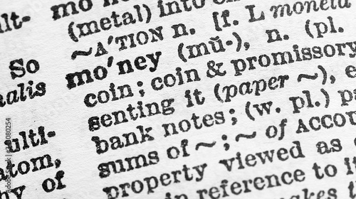 Money - Closeup macro of English dictionary page with word money concept