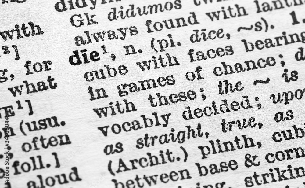 Die - Closeup macro of English dictionary page with word die concept Die - Closeup macro of English dictionary page with word die concept
