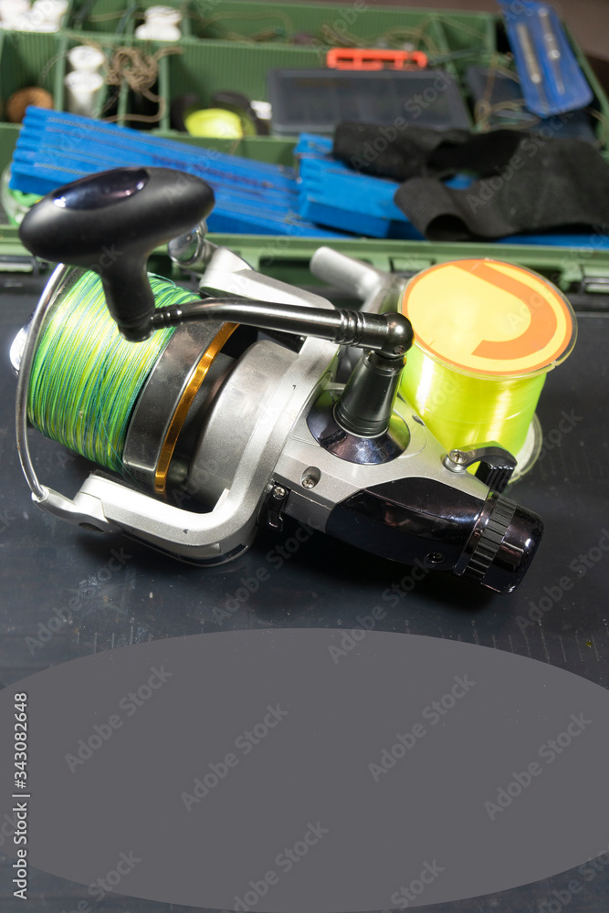 Fishing equipment on a old wooden table. Sport and recreation concept Fishing equipment on a old wooden table. Sport and recreation concept