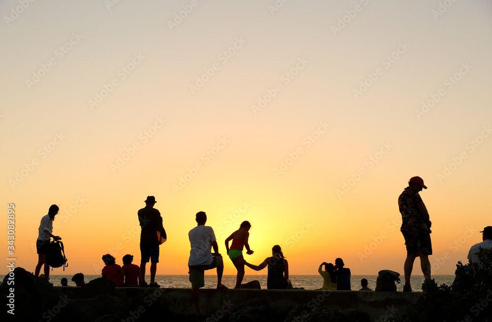 A Group of Tourists Watching Sunset at Fort Zachary Taylor Historic State Park, better known as Fort Taylor, Florida USA