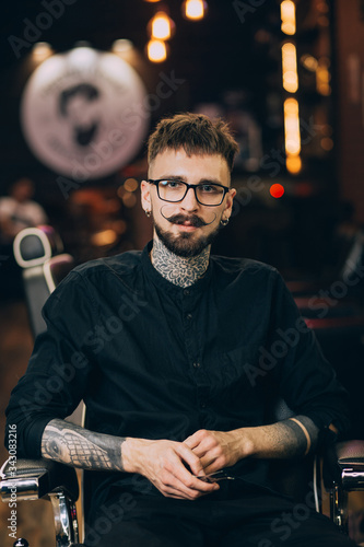 Well groomed hipster. Barbershop concept. Beauty industry. Facial hair care. Mature man bearded hipster with long beard and mustache. Styling mustache. Growing long mustache. Moustache style