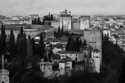 View of the Alhambra and the Generalife and the city of Granada from the viewpoint of the Silla del Moro at sunrise.