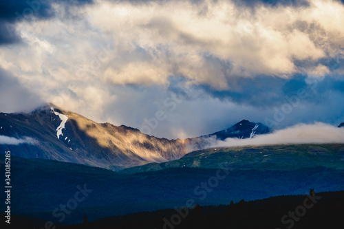 Spectacular view of a mountain range in the clouds in Ulagansky district of the Altai Republic, Russia © Sergei Elagin