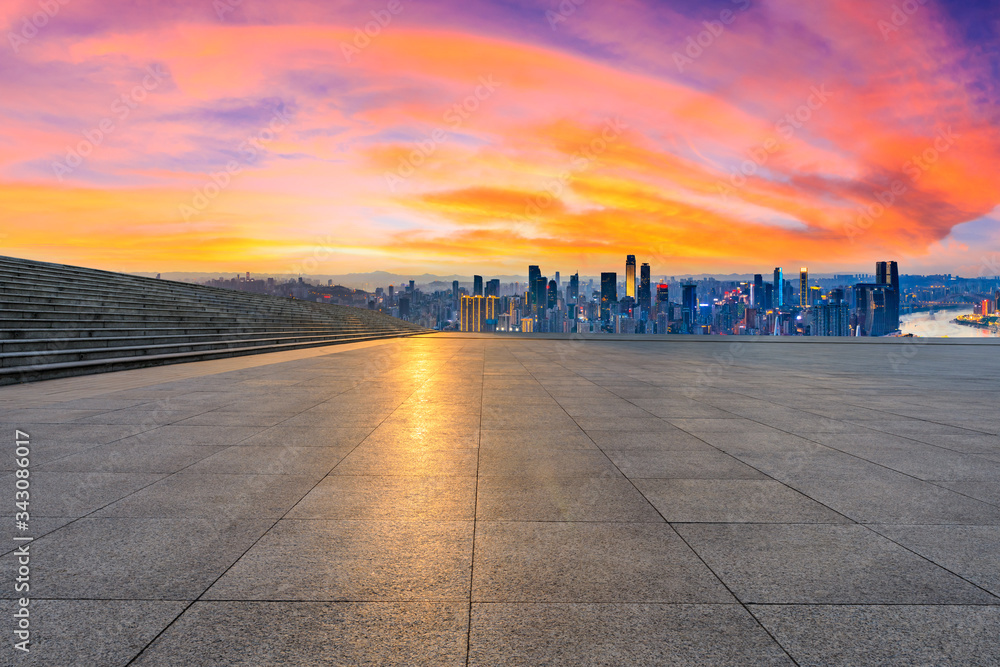 Empty square floor and chongqing city skyline at sunset,China.