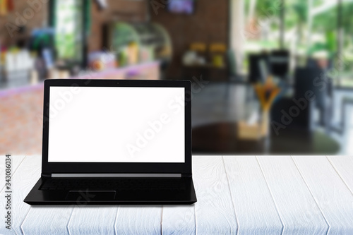 Wallpaper Mural Laptop with blank screen on white wooden table. coffee shop blurred background. Torontodigital.ca