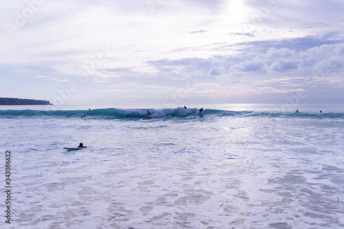 Surfing on the island of Bali in the Pacific and Indian Ocean. Male surfers engage in active sports on sick waves © Underwater girls