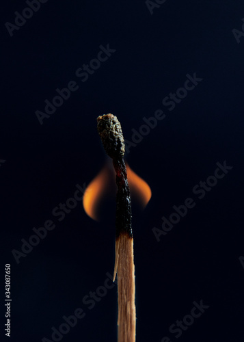 Roll of matchsticks has ignited, showing fired light up in isolated.