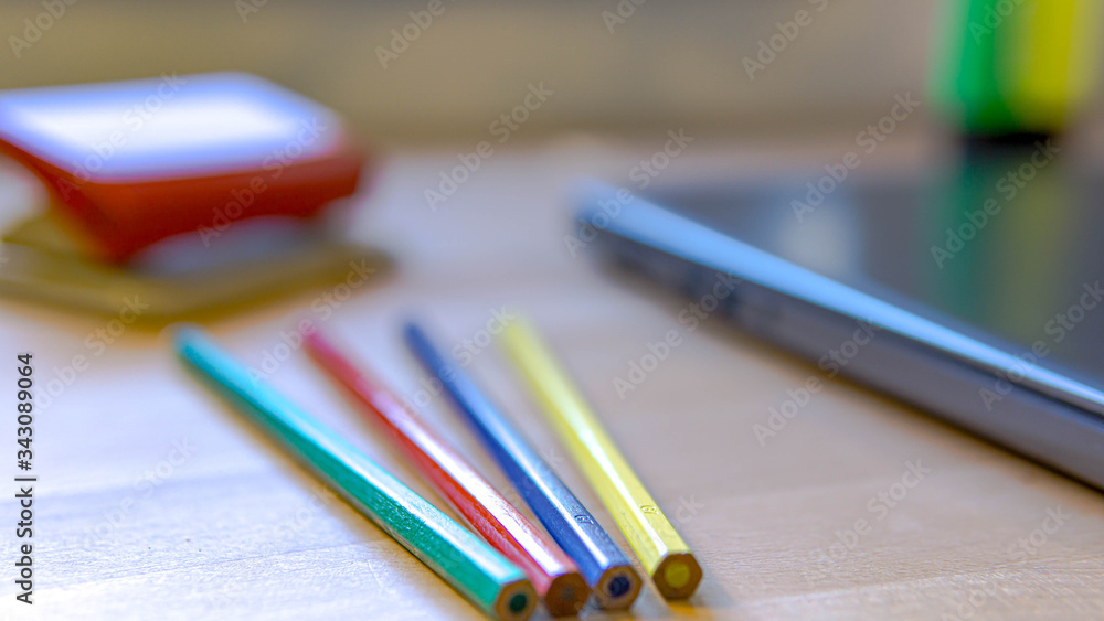 colored pencils on a table colored pencils on a table