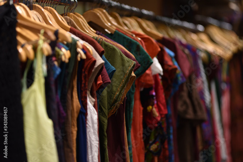 Row of Turkish traditional dresses in clothes store in selective focus
