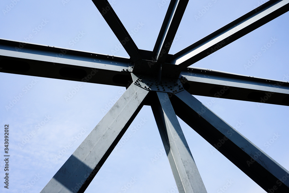 Iron construction in the form of an asterisk against a blue sky.
