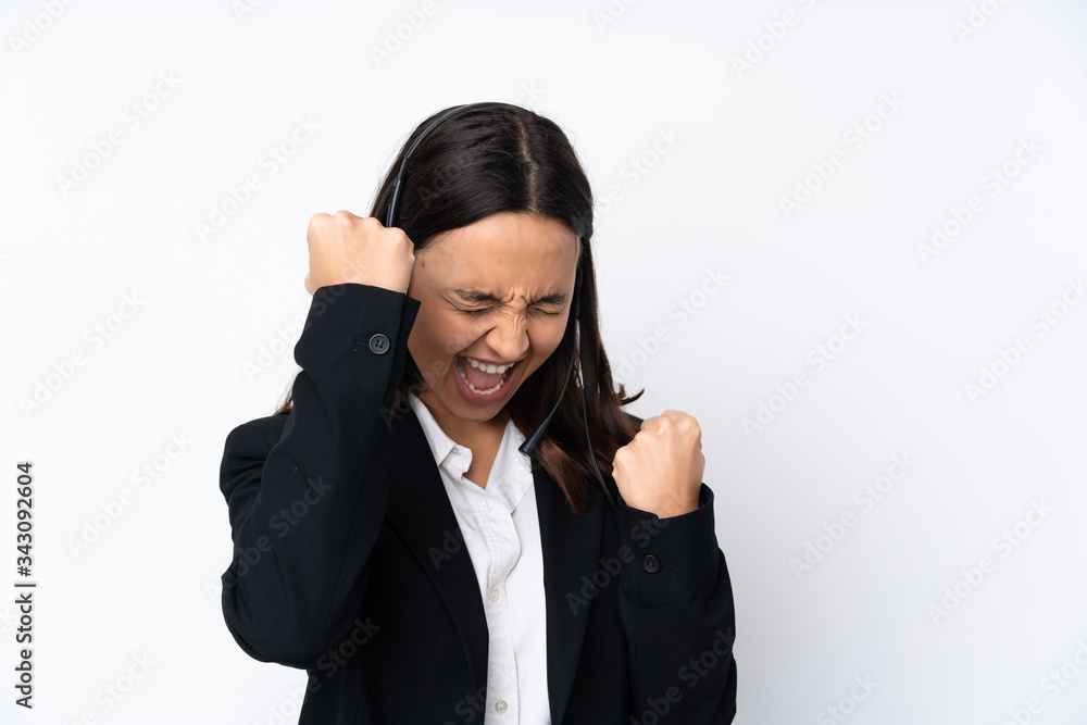 Young telemarketer woman isolated on white background celebrating a victory Young telemarketer woman isolated on white background celebrating a victory